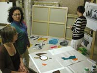discussing the art works in studio